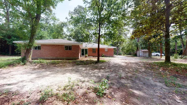 a view of tree in front of a house