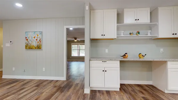 a view of cabinets and wooden floor