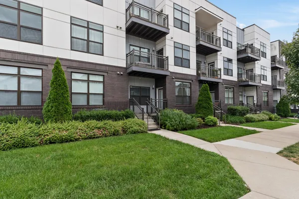 a view of a building with a yard