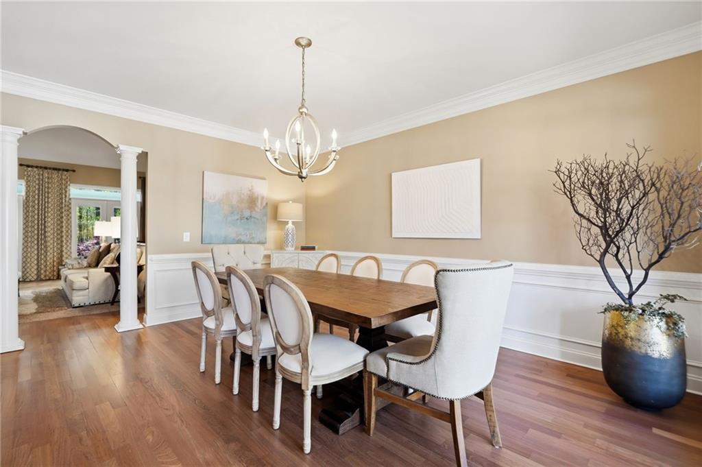 4147 Gold Mill Ridge Canton, GA 30114 - Photo 9 of 93 a view of a dining room with furniture wooden floor and chandelier