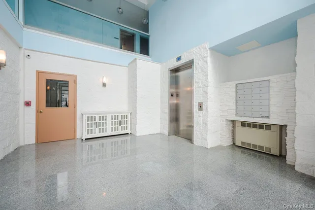 a view of a big room with windows and wardrobe