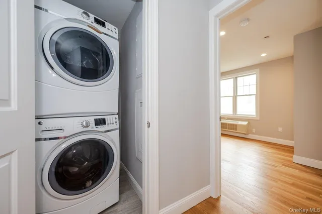 a view of a hallway with washer and dryer
