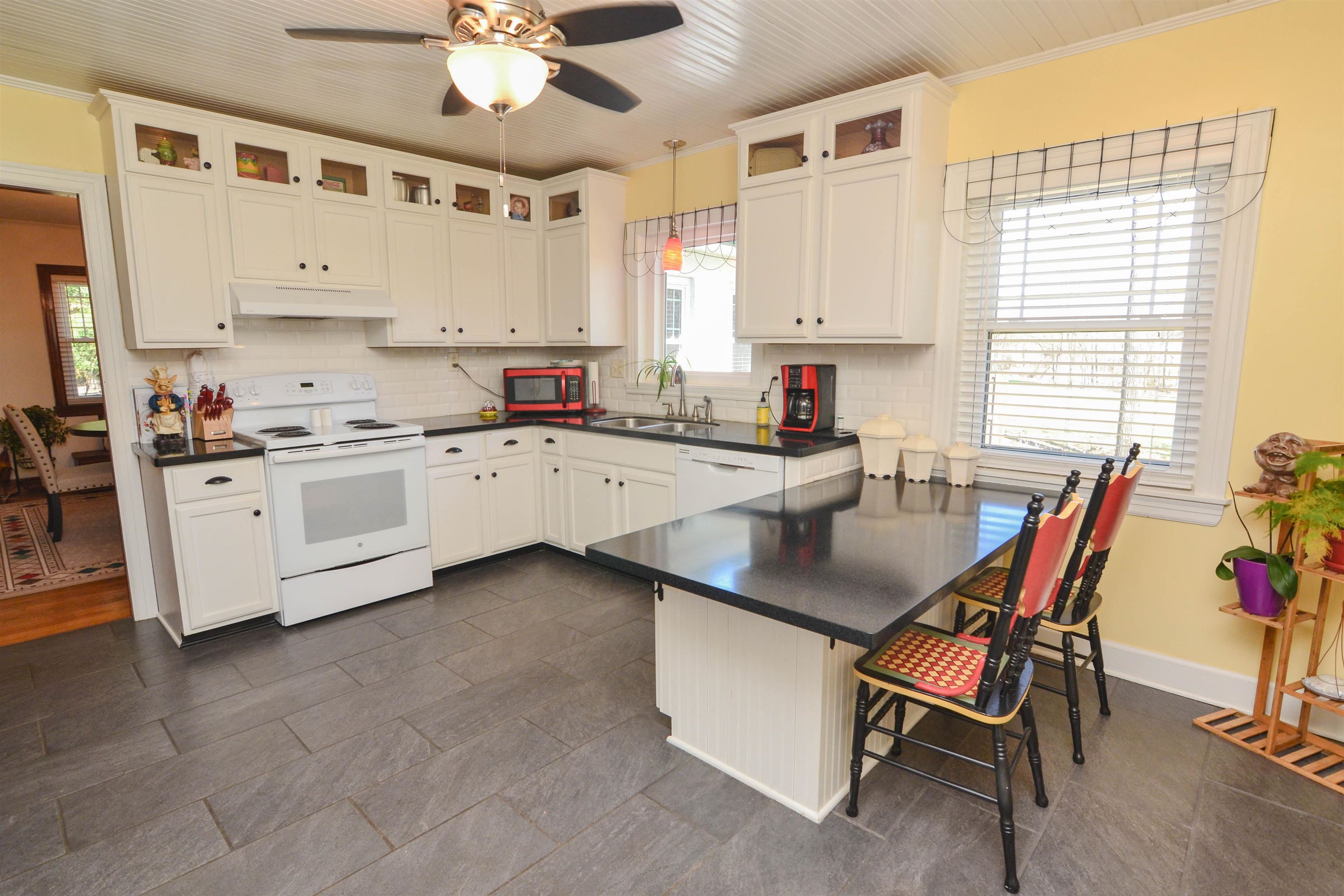 328 McQuiston Road Brighton, TN 38011 - Photo 10 of 25 The open kitchen has lots of windows, cabinets and counter space.