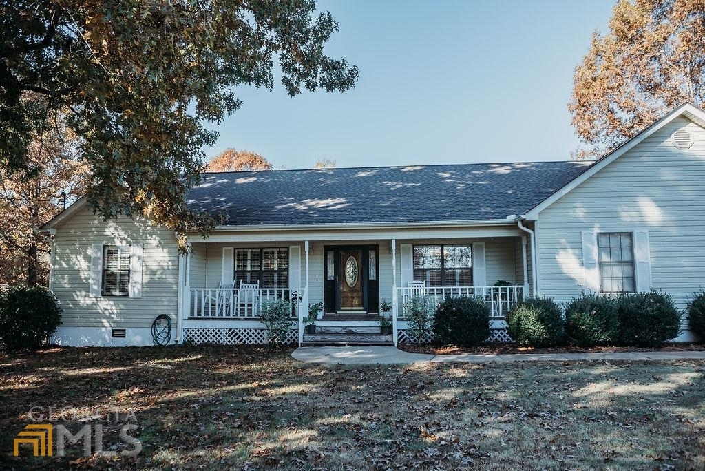 70 Flowers Road Molena, GA 30258 - Photo 1 of 1 a front view of a house with garden
