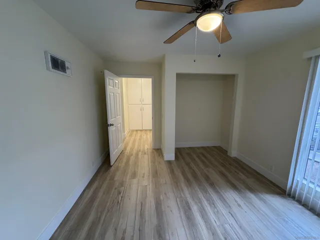 a view of wooden floor in an empty room