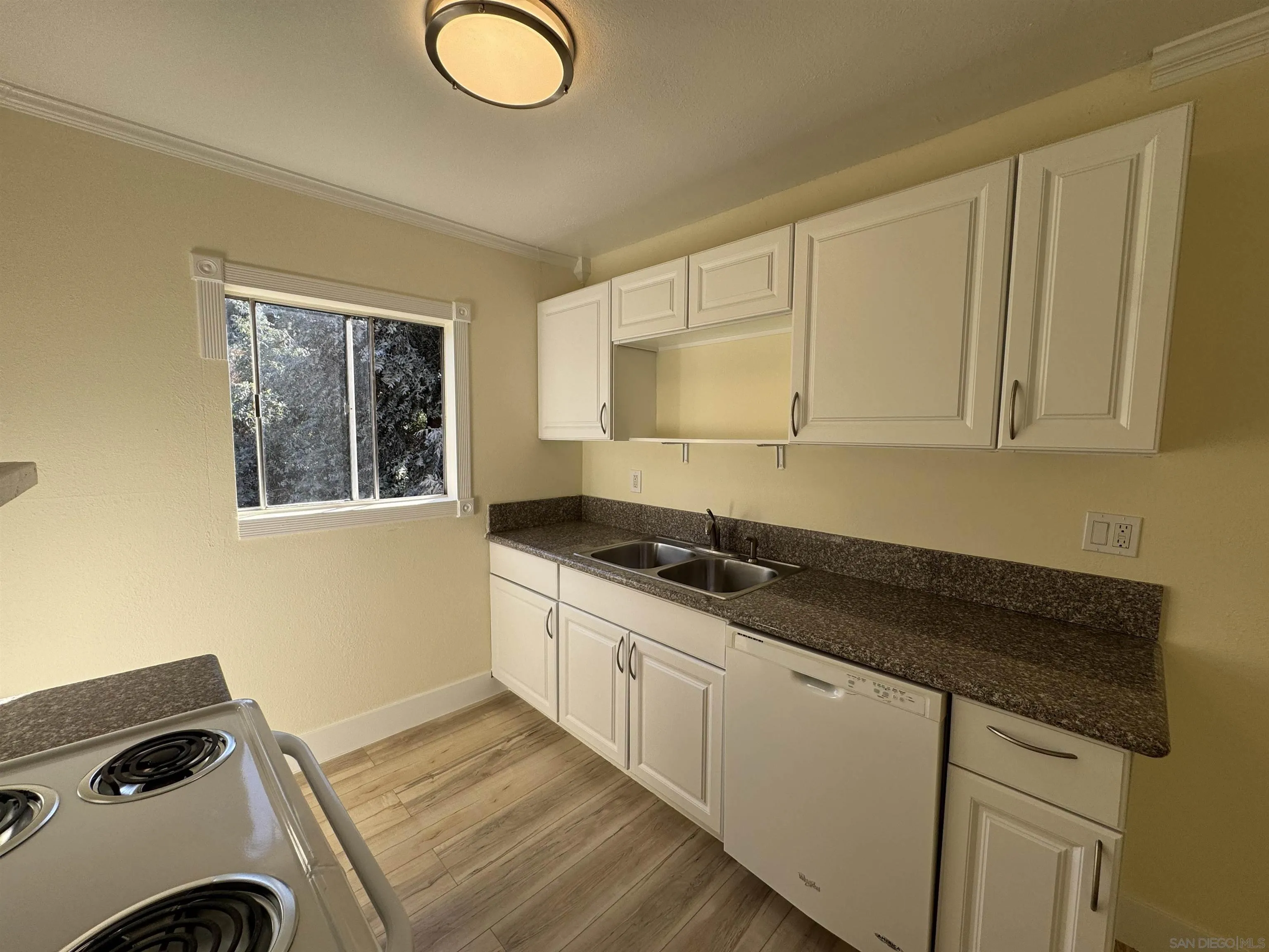 12923 Mapleview Street, Unit 8 Lakeside, CA 92040 - Photo 9 of 25 a kitchen with a sink and cabinets