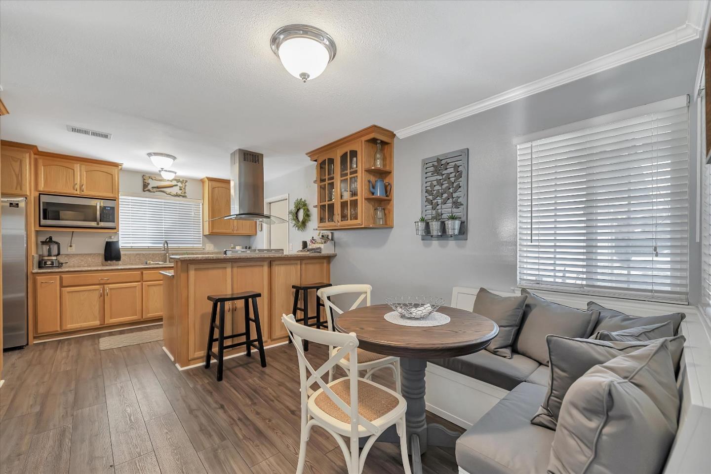 1391 3rd Street Gilroy, CA 95020 - Photo 14 of 40 a view of a dining room with furniture and wooden floor
