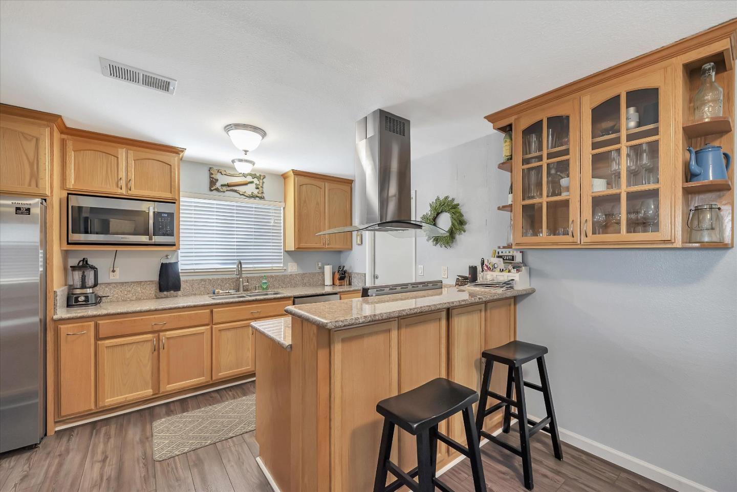 1391 3rd Street Gilroy, CA 95020 - Photo 16 of 40 a kitchen with a sink and cabinets