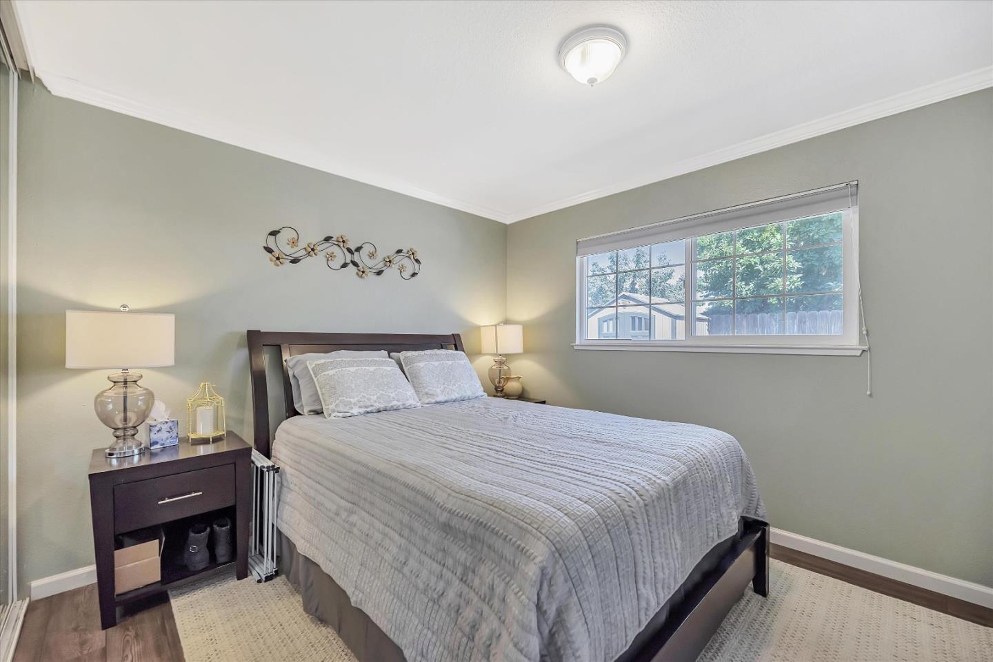 1391 3rd Street Gilroy, CA 95020 - Photo 22 of 40 a bedroom with a bed and a table