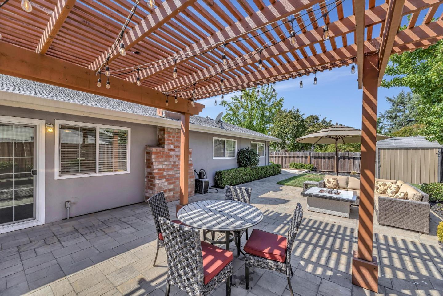 1391 3rd Street Gilroy, CA 95020 - Photo 35 of 40 a view of a patio with table and chairs and potted plants