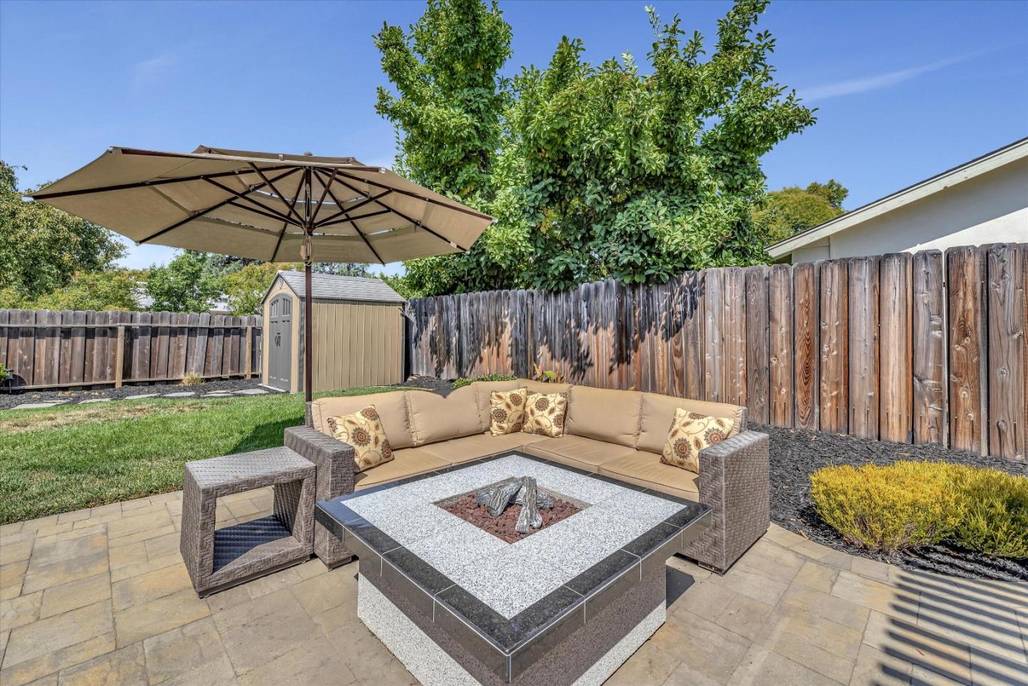 1391 3rd Street Gilroy, CA 95020 - Photo 36 of 40 a view of a sitting area with furniture and umbrella