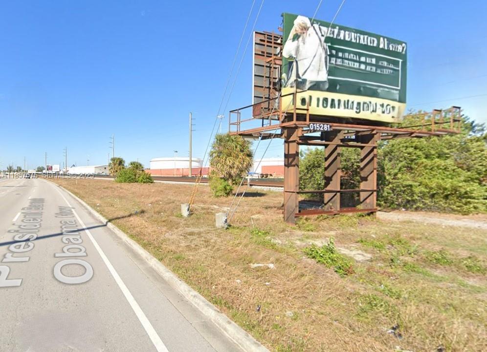 0 Old Dixie Highway Riviera Beach, FL 33404 - Photo 1 of 11 a view of a street with a building in the background