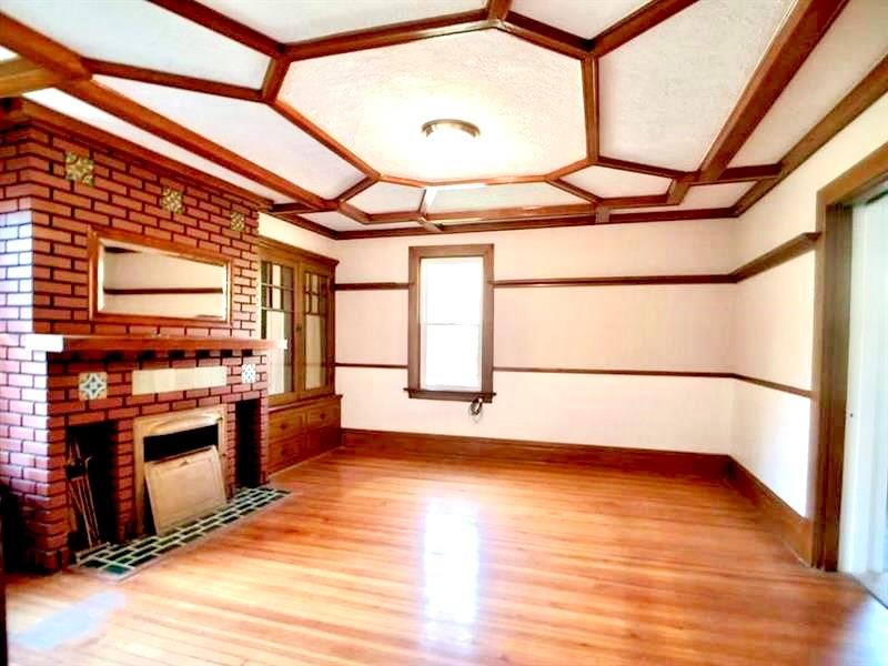 2118 Monroeville Road Monroeville, PA 15146 - Photo 4 of 11 a view of an empty room with a window and wooden floor