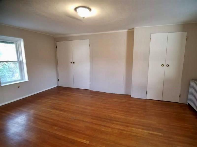 2118 Monroeville Road Monroeville, PA 15146 - Photo 6 of 11 an empty room with wooden floor and windows