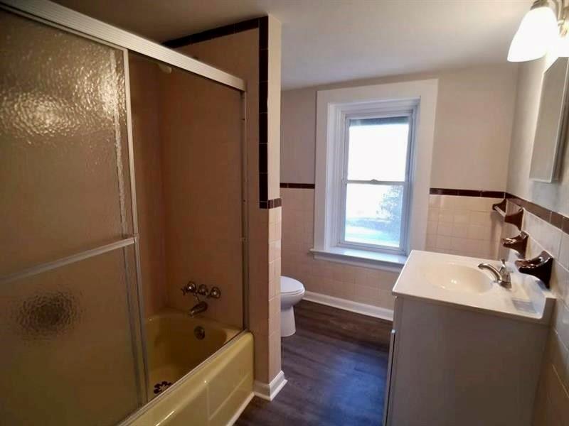 2118 Monroeville Road Monroeville, PA 15146 - Photo 9 of 11 a bathroom with a bathtub and a sink