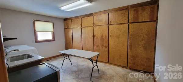 a utility room with a sink a washer and dryer
