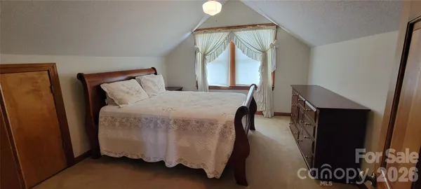 a living room with furniture and chandelier