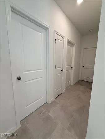 a view of a hallway with white walls
