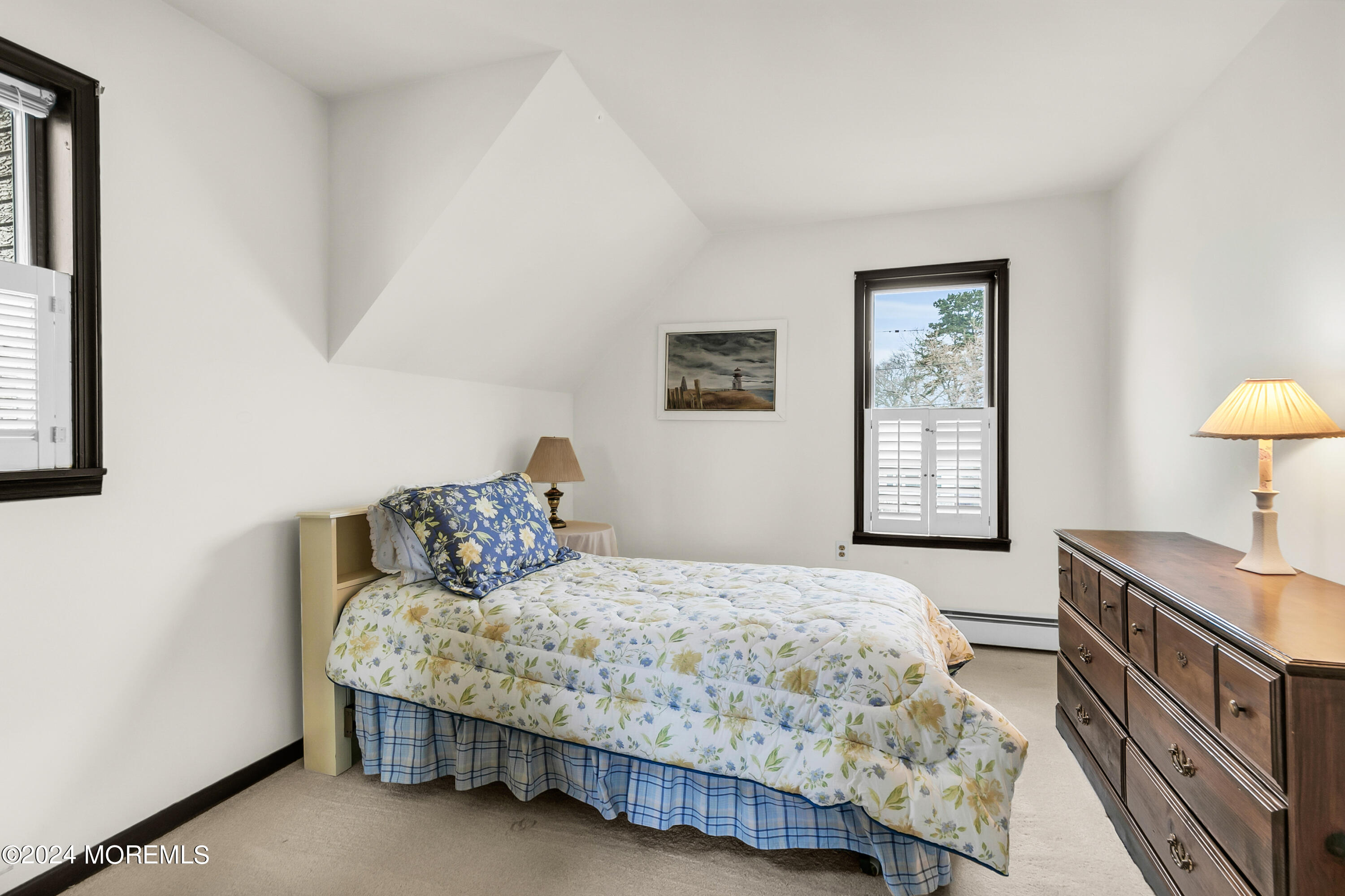 35 Bay Way Brick, NJ 08723 - Photo 41 of 48 a bedroom with a bed and a lamp on table