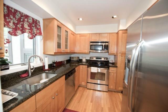 668 Glenbrook Road, Unit 15 Stamford, CT 06906 - Photo 1 of 1 a kitchen with stainless steel appliances granite countertop a sink a stove and a refrigerator