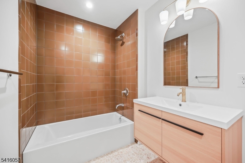 1209 Littleton Road, Unit A Morris Plains, NJ 07950 - Photo 11 of 23 a bathroom with a bathtub and a sink