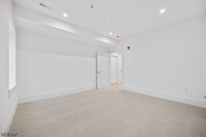 1209 Littleton Road, Unit A Morris Plains, NJ 07950 - Photo 14 of 23 an empty room with an entryway