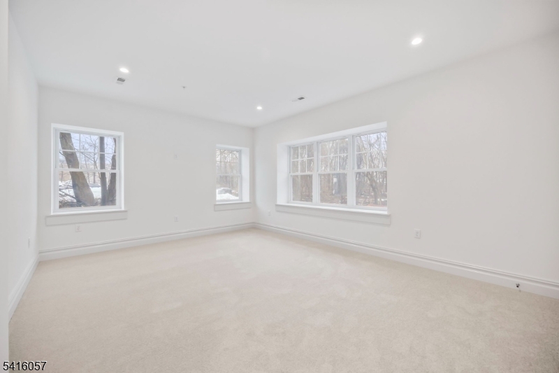 1209 Littleton Road, Unit A Morris Plains, NJ 07950 - Photo 16 of 23 a view of an empty room with a window