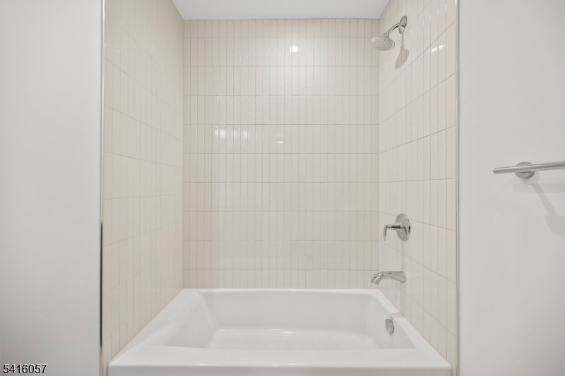 1209 Littleton Road, Unit A Morris Plains, NJ 07950 - Photo 19 of 23 a close view of a bathtub in a bathroom