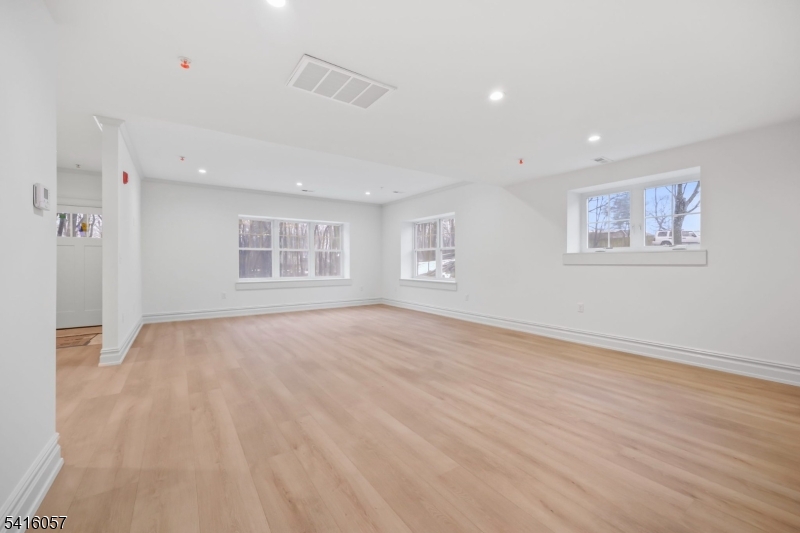 1209 Littleton Road, Unit A Morris Plains, NJ 07950 - Photo 3 of 23 a view of empty room with wooden floor and fan