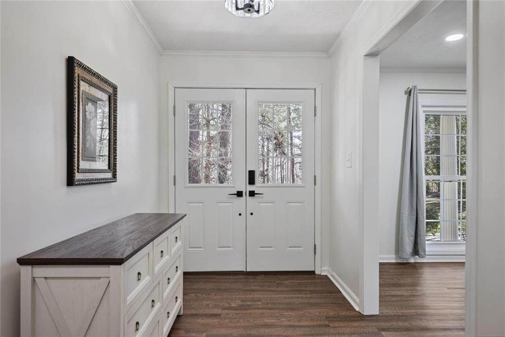 4505 Cochran Mill Road Fairburn, GA 30213 - Photo 4 of 36 a view of a kitchen with wooden floor cabinets and a window