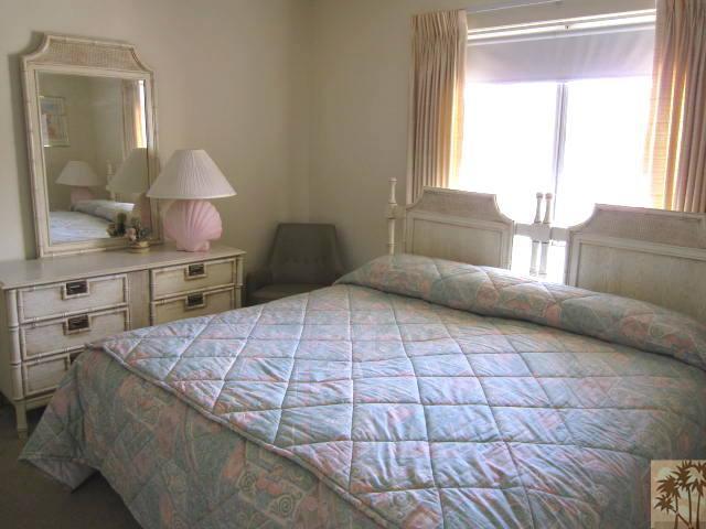 1268 Ramon Road, Unit 52 Palm Springs, CA 92264 - Photo 13 of 22 a bedroom with a large bed and a window