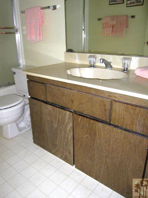 1268 Ramon Road, Unit 52 Palm Springs, CA 92264 - Photo 15 of 22 a bathroom with a sink a toilet and mirror