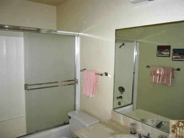 1268 Ramon Road, Unit 52 Palm Springs, CA 92264 - Photo 16 of 22 a bathroom with a shower and a sink
