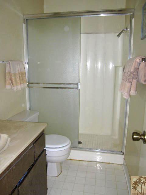 1268 Ramon Road, Unit 52 Palm Springs, CA 92264 - Photo 18 of 22 a bathroom with a sink a toilet and shower