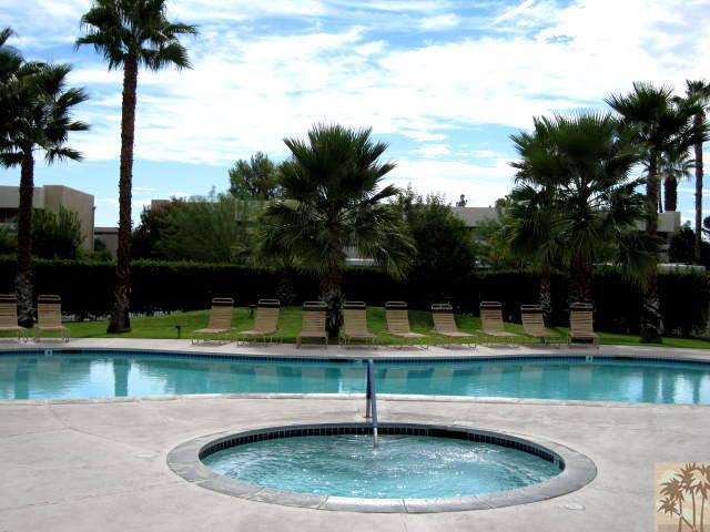 1268 Ramon Road, Unit 52 Palm Springs, CA 92264 - Photo 22 of 22 a view of a swimming pool with a lake view