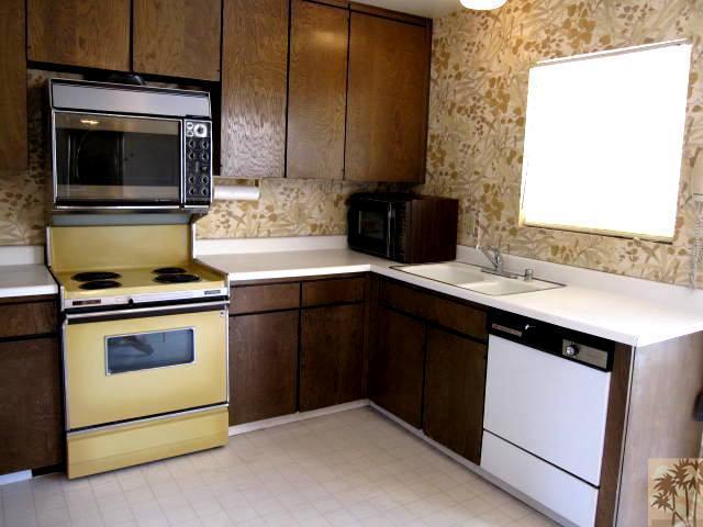 1268 Ramon Road, Unit 52 Palm Springs, CA 92264 - Photo 4 of 22 a kitchen with a stove and a microwave