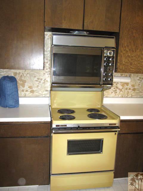1268 Ramon Road, Unit 52 Palm Springs, CA 92264 - Photo 5 of 22 a stove top oven sitting inside of a kitchen