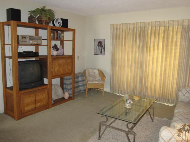1268 Ramon Road, Unit 52 Palm Springs, CA 92264 - Photo 7 of 22 a living room with furniture and a window