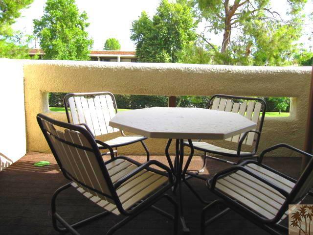 1268 Ramon Road, Unit 52 Palm Springs, CA 92264 - Photo 9 of 22 a view of a chairs and table on the roof deck