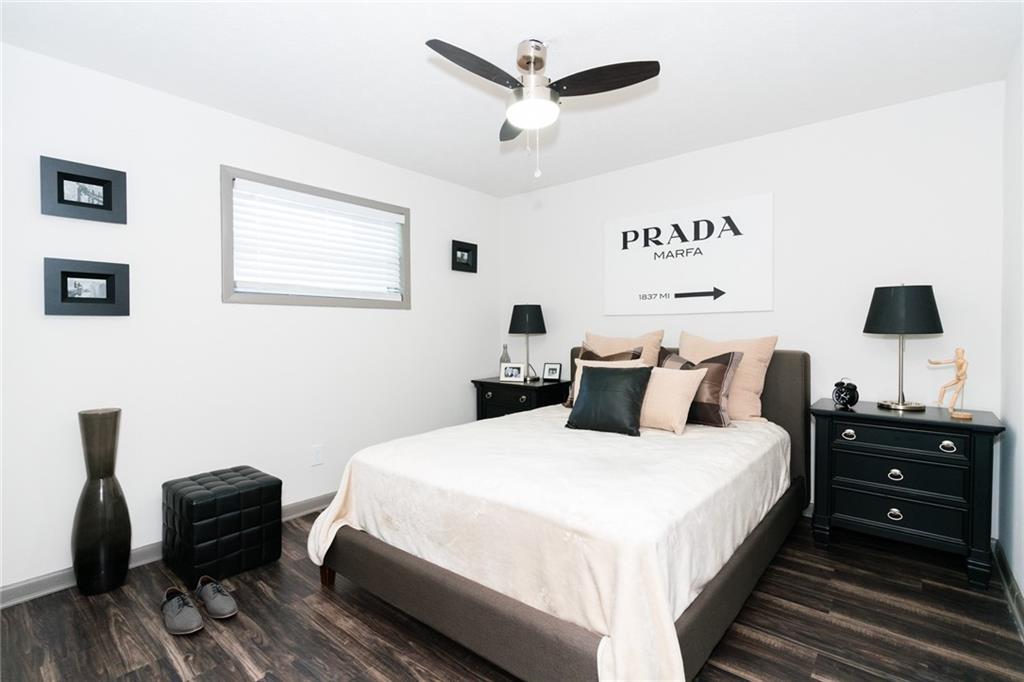 921 Myrtle Street Northeast, Unit MYRT006 Atlanta, GA 30309 - Photo 12 of 21 a bedroom with a bed and a chair