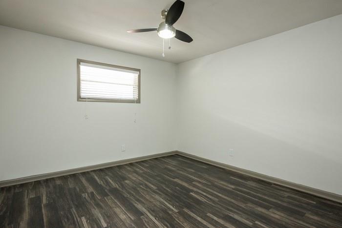 921 Myrtle Street Northeast, Unit MYRT006 Atlanta, GA 30309 - Photo 14 of 21 a view of a room with wooden floor and ceiling fan