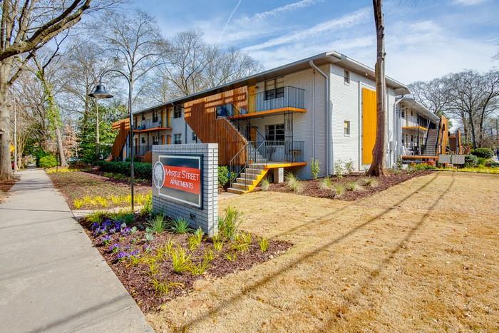 921 Myrtle Street Northeast, Unit MYRT006 Atlanta, GA 30309 - Photo 18 of 21 a front view of a house with garden