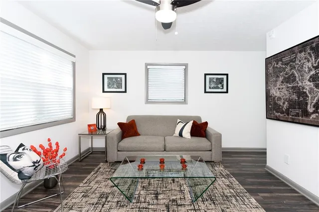 a living room with furniture and a rug