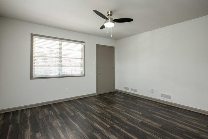 921 Myrtle Street Northeast, Unit MYRT006 Atlanta, GA 30309 - Photo 10 of 21 a view of an empty room with wooden floor and a window