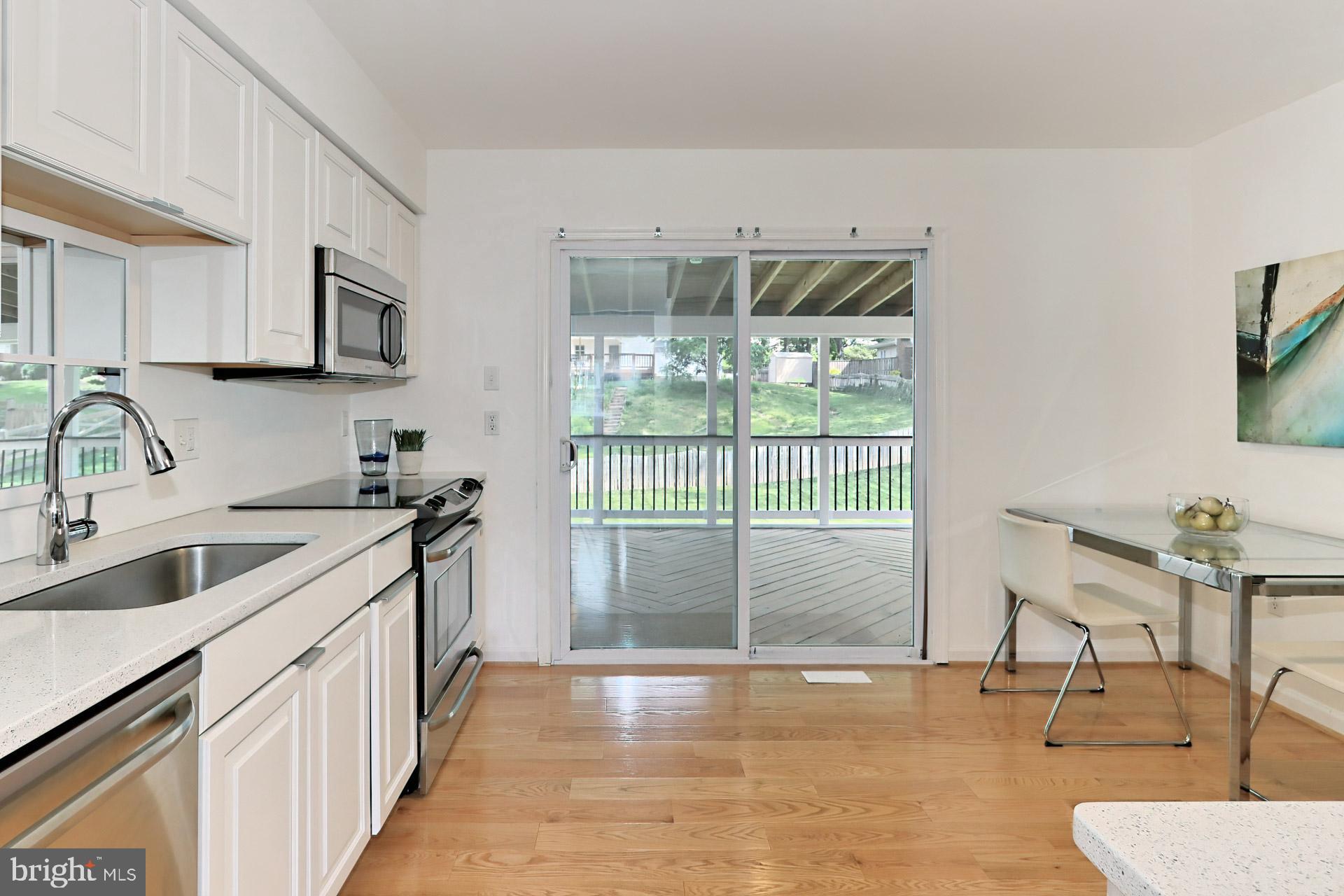 9110 Rockefeller Lane Springfield, VA 22153 - Photo 17 of 56 Sliding doors lead to the screened in porch