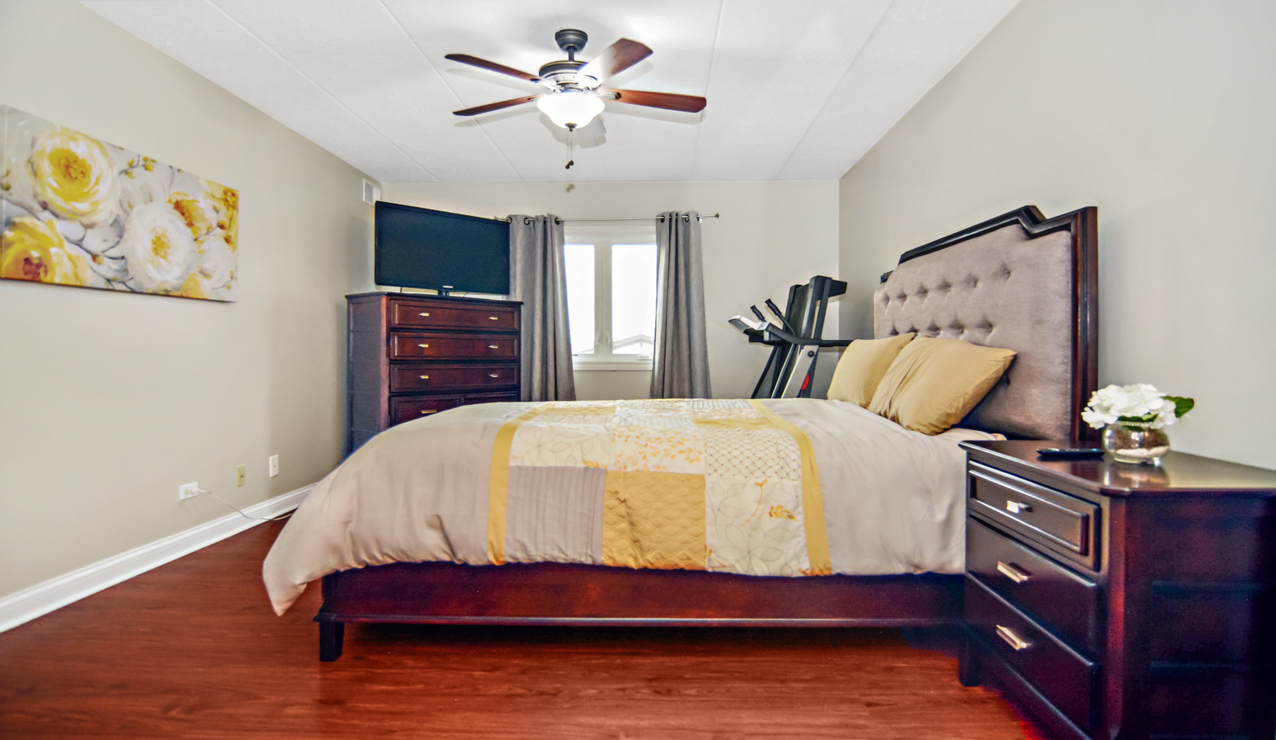 10630 Ridgeland Avenue, Unit 2A Chicago Ridge, IL 60415 - Photo 12 of 19 a bedroom with a bed and painting on the wall