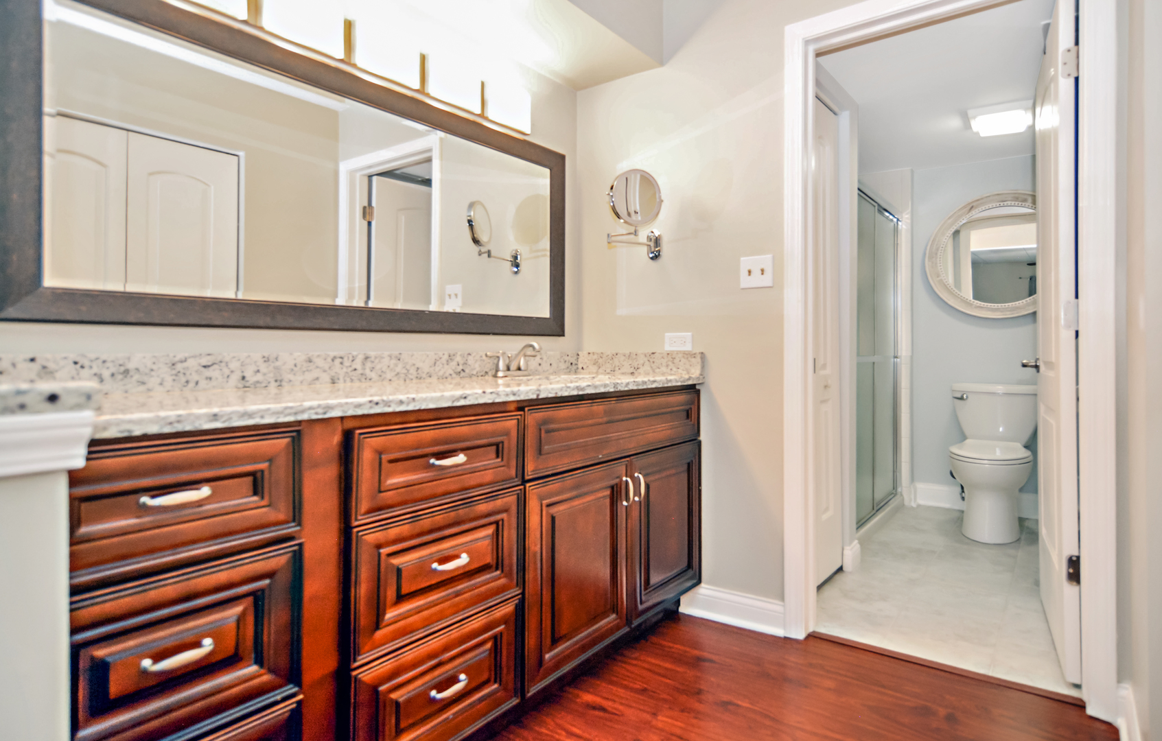 10630 Ridgeland Avenue, Unit 2A Chicago Ridge, IL 60415 - Photo 13 of 19 a bathroom with a sink a toilet and shower