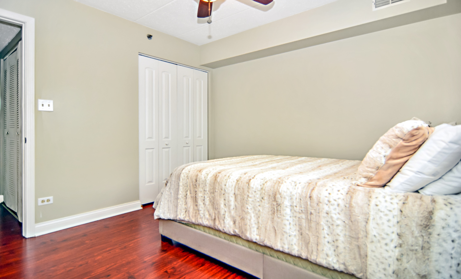 10630 Ridgeland Avenue, Unit 2A Chicago Ridge, IL 60415 - Photo 14 of 19 a bedroom with a bed and a window