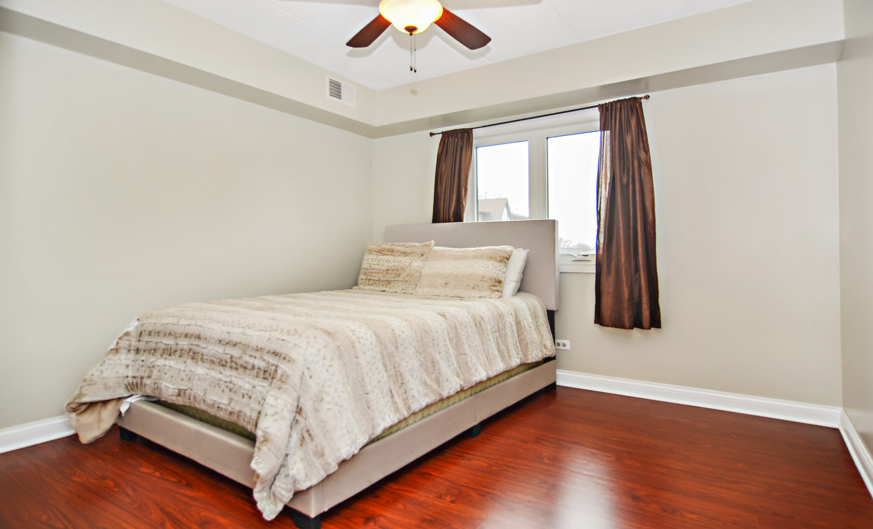 10630 Ridgeland Avenue, Unit 2A Chicago Ridge, IL 60415 - Photo 15 of 19 a bedroom with a bed and window