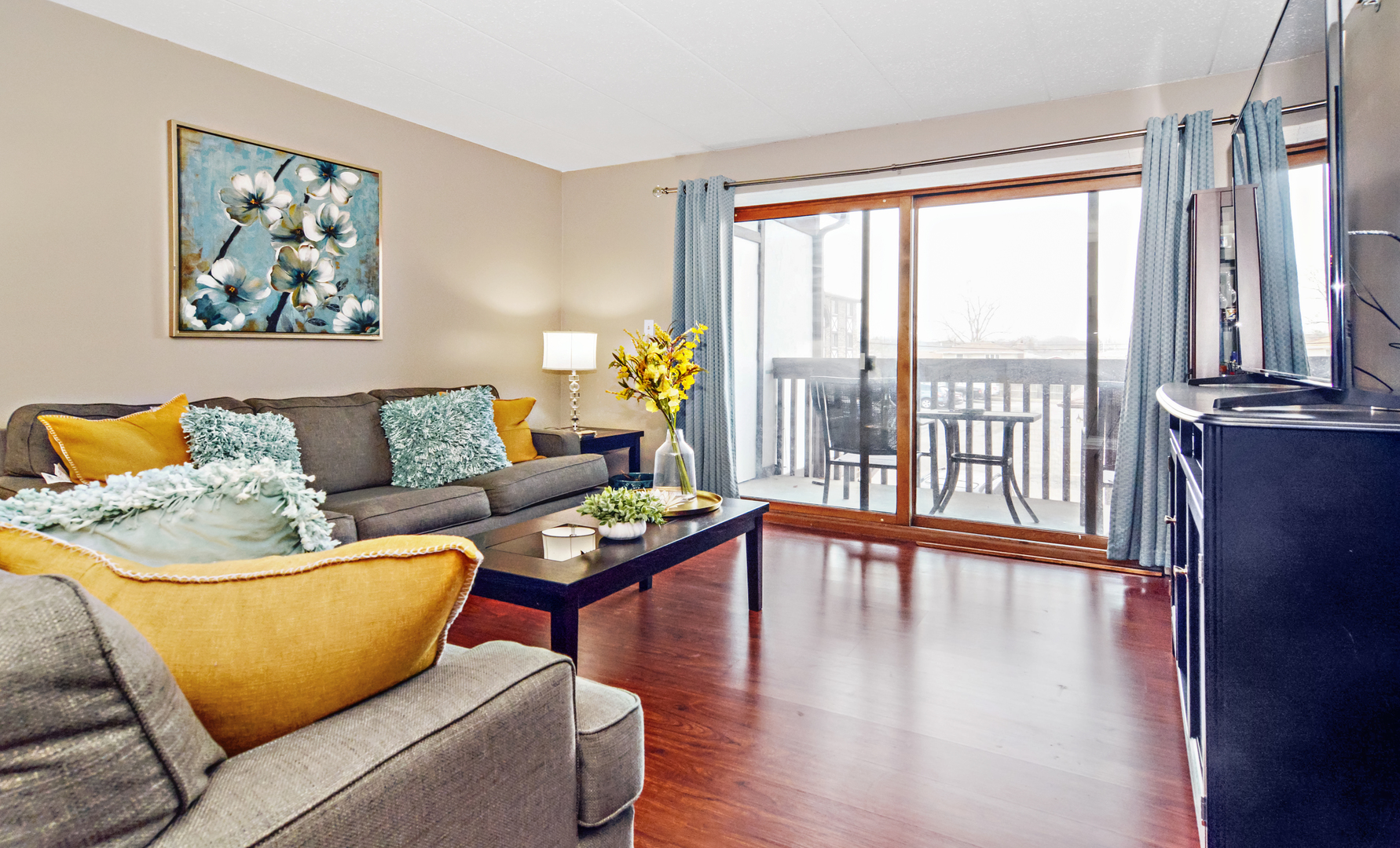 10630 Ridgeland Avenue, Unit 2A Chicago Ridge, IL 60415 - Photo 2 of 19 a living room with furniture and a large window